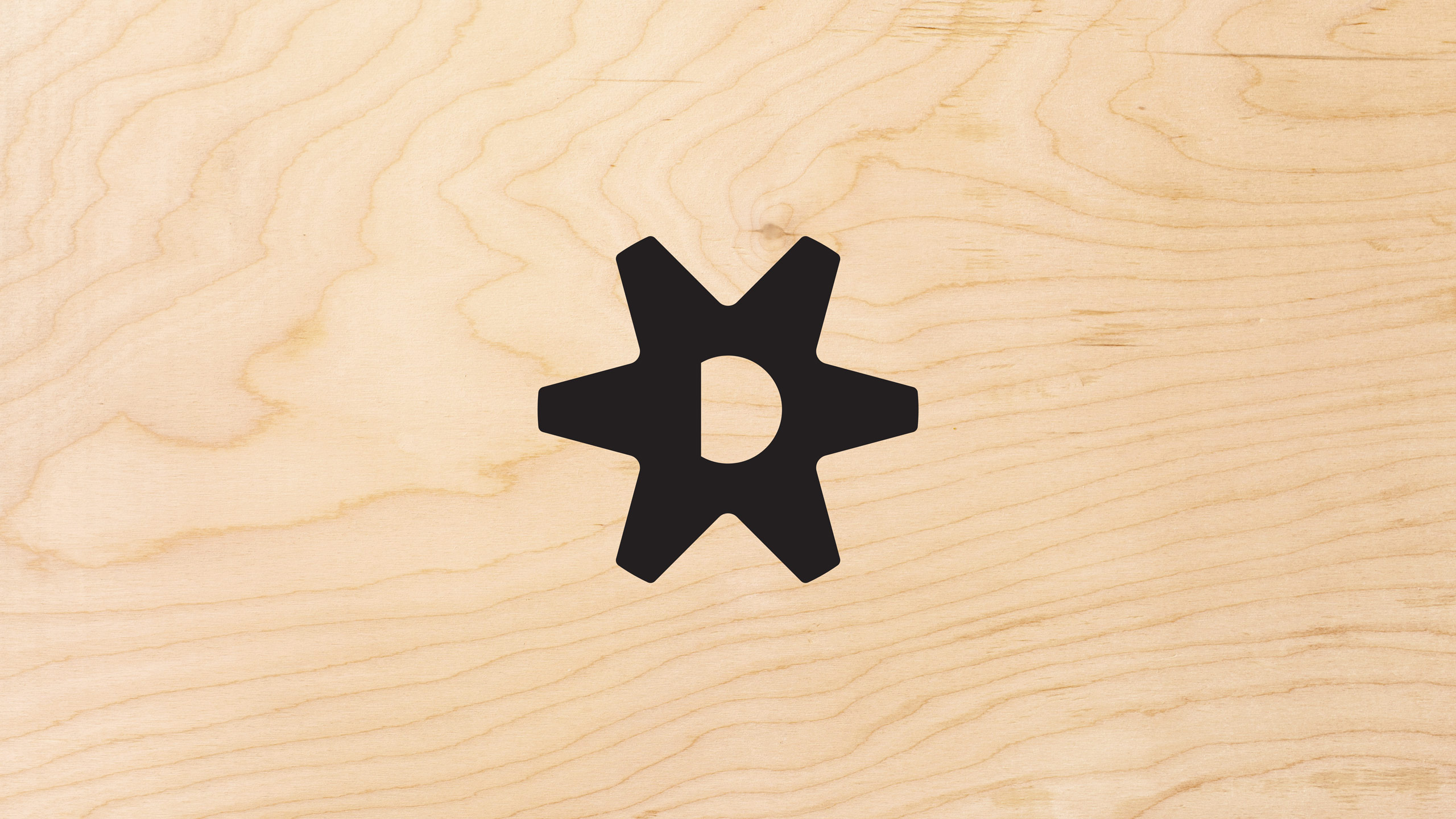 The Discount Factory Home & Appliance Outlet icon logo in black on a light tan woodgrain texture