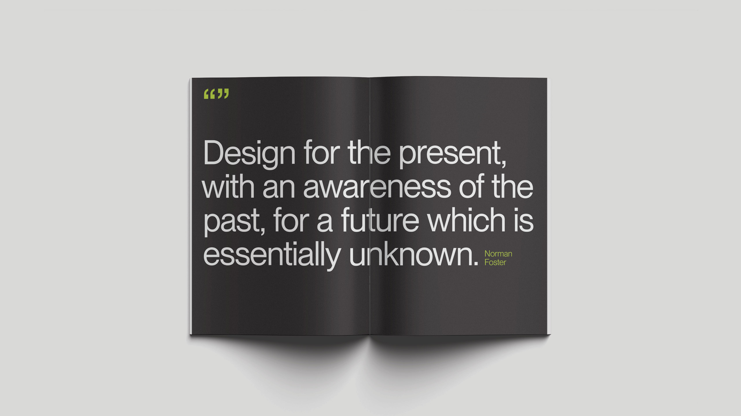Open book with a black double-page spread showing a quote in white text: "Design for the present, with an awareness of the past, for a future which is essentially unknown."