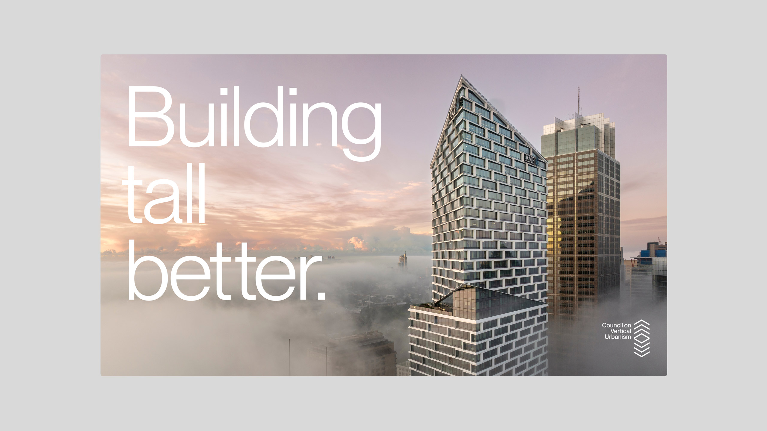 A modern skyscraper rises above fog under a pink sunrise, with the text "Building tall better" in bold white.