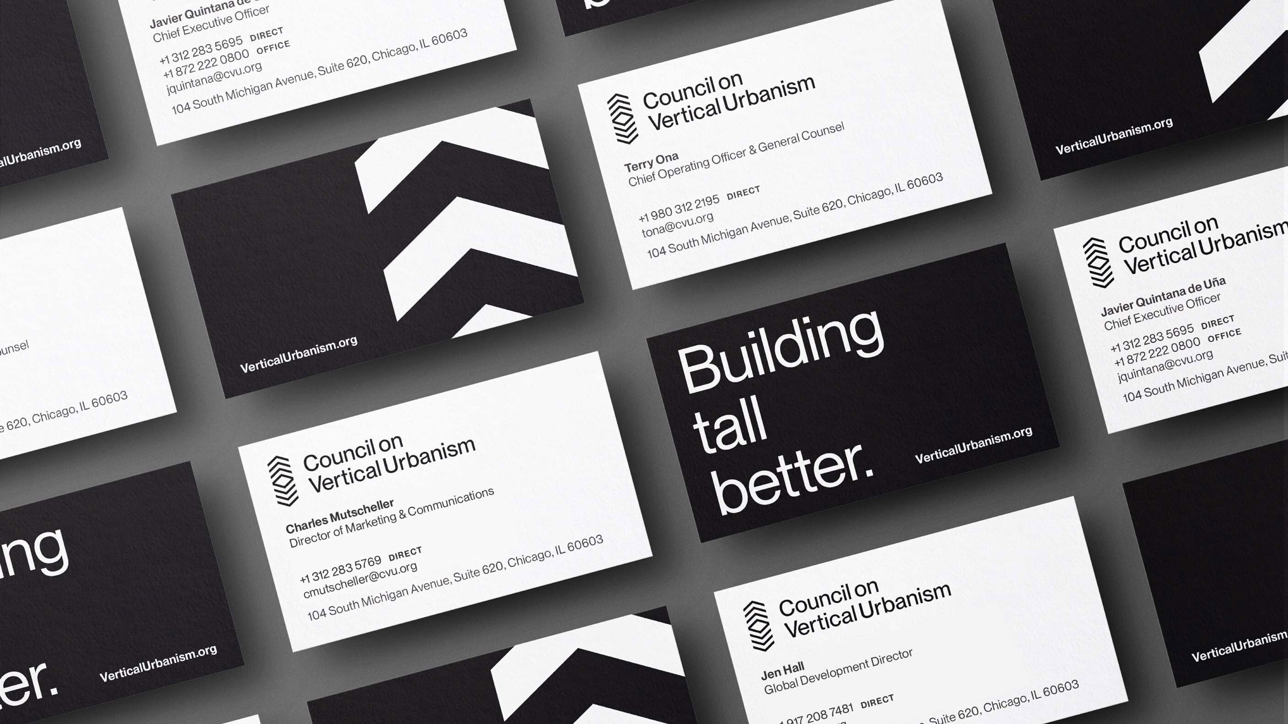 Array of business cards for the Council on Vertical Urbanism. White cards feature contact info; black cards show bold text and chevron designs.