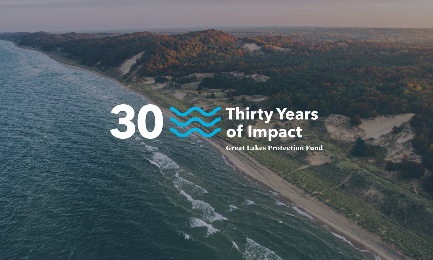 Coastal landscape with waves in the foreground and a forested shoreline. The logo is on top and the text reads "30 Thirty Years of Impact, Great Lakes Protection Fund."