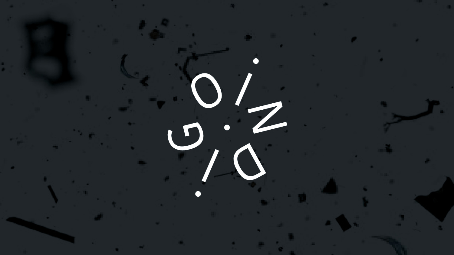 The word "INDIGO" is creatively arranged in a spiral on a dark, speckled background.